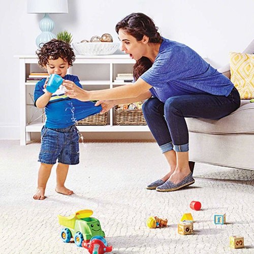 Mom playing with child in living room with beige textured LifeGuard waterproof carpet from Korfhage Floor Covering in the Louisville, KY area