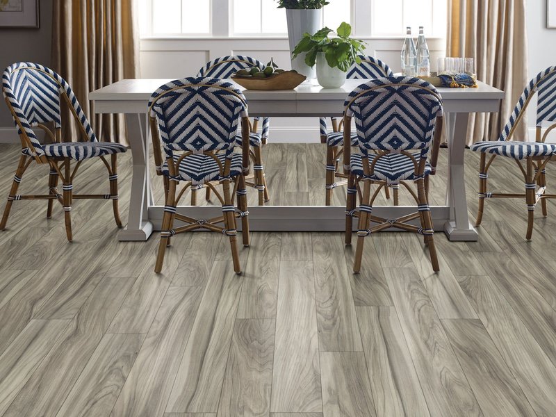 Dining room with wood-look laminate flooring from Korfhage Floor Covering in the Louisville, KY area